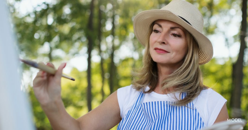 Woman working outdoors using sun protection